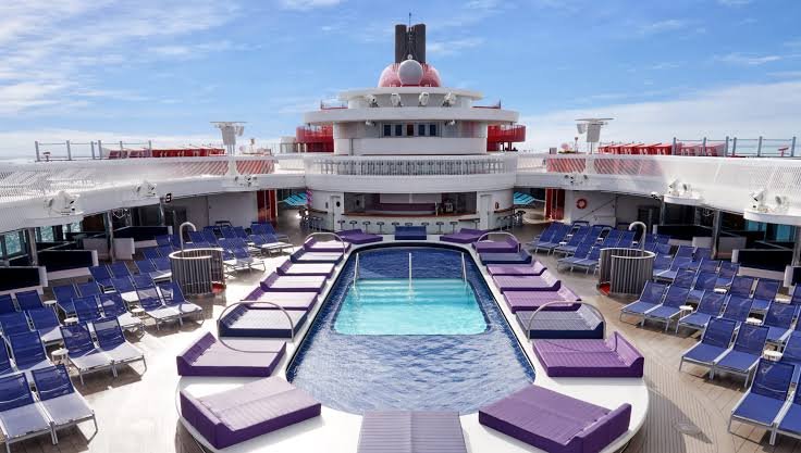 Virgin Voyages Review Traditional waterslides for chic, adult-centric lounge decks.. Source: VV Insider